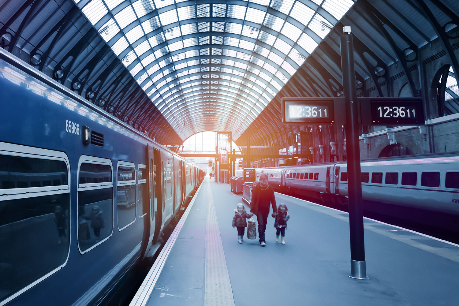 Photo of family walking in a train station